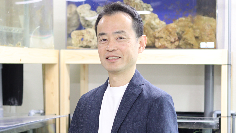 Motoki Totsugi, founder of Tokyo Aqua Garden, in the company fish room